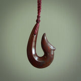 Hand carved Red Jasper Stone pendant. Hook, matau pendant hand made in New Zealand. NZ Pacific jewellery for sale online.