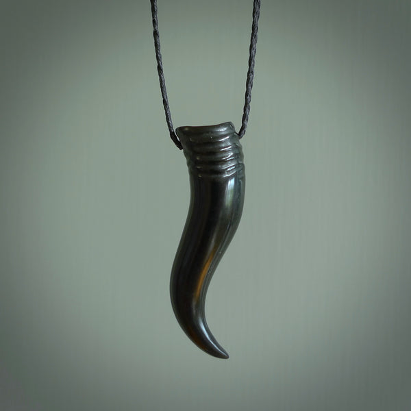 Black jade Italian Horn pendant. Handmade jade jewellery made by NZ Pacific and for sale online. Black Jade Goat Horn pendant worn for protection over evil eye, bad luck and promotes fertility. Ancient symbolic necklace hand made in Australian Black Jade.