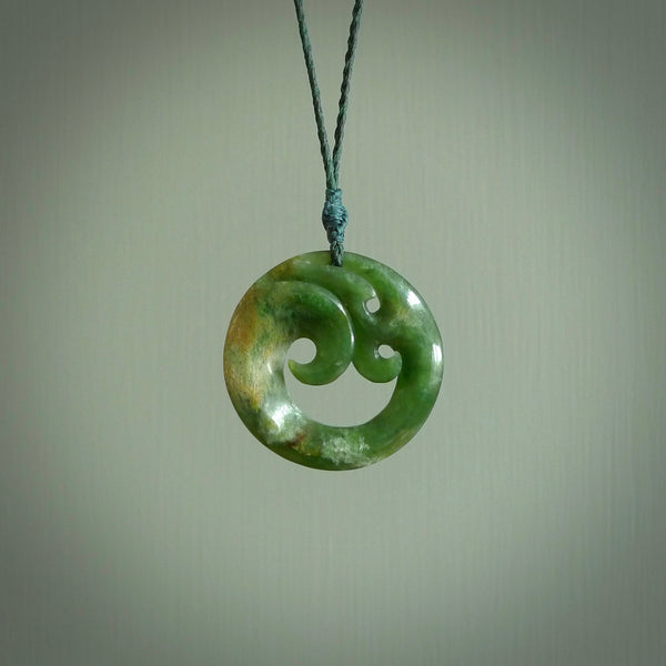 This pendant is a complex koru design. Carved in gorgeous New Zealand jade it is a medium sized pendant that can be worn by anyone. Hand made in New Zealand by NZ Pacific.