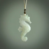 A hand carved Jadeite seahorse pendant. We have carved this from beautiful jadeite and we bind them with our hand-plaited cords. The cords are a waxed polyester so they are durable and strong. We ship these worldwide with express courier anywhere in the world.
