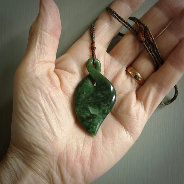 Hand carved New Zealand jade, single twist pendant. Maori pikorua pendant hand carved in New Zealand. Made by NZ Pacific, jade jewellery for sale online. One only hand made by Ross Crump.