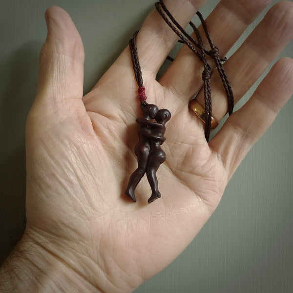 This medium sized couples embrace pendant is made from Red Jasper Stone. We've hand carved this piece for all the lovers out there. Free postage worldwide. Red Jasper Stone couple hugging jewellery.