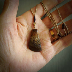 This is a medium sized, hand carved toki pendant. It is made from banksia wood. This is a medium sized Toki and very unique, one only, pendant that is a collectors piece. Hand carved by New Zealand artist, Sami.