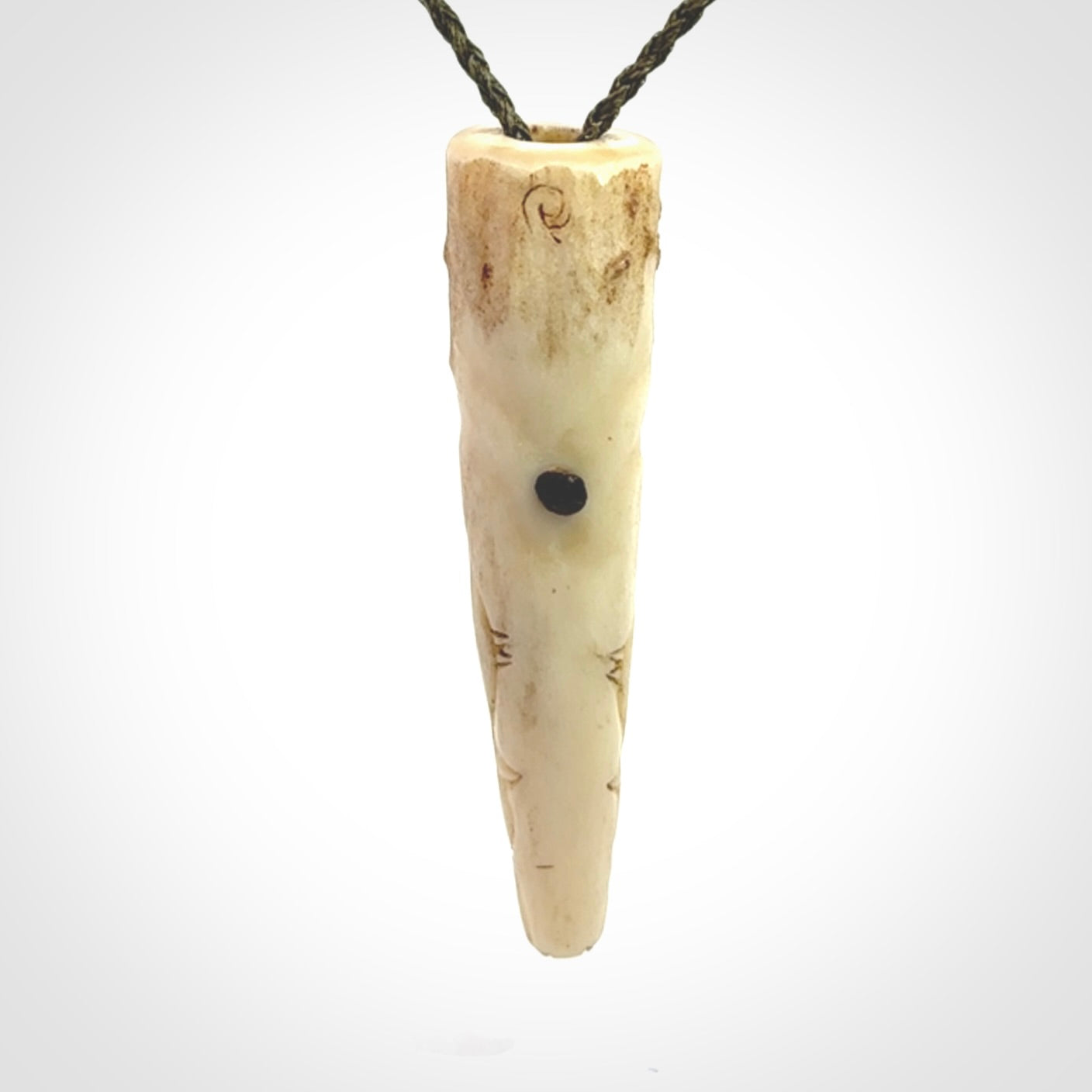 A hand carved crocodile pendant carved from a piece of deer antler. This is a work of art carved by Fumio Noguchi who is renowned for his skill in bone carving.