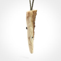 A hand carved crocodile pendant carved from a piece of deer antler. This is a work of art carved by Fumio Noguchi who is renowned for his skill in bone carving.