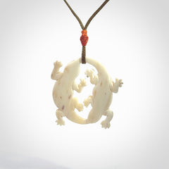 Hand carved bone double lizard pendant.