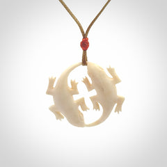 Hand carved bone double lizard pendant.