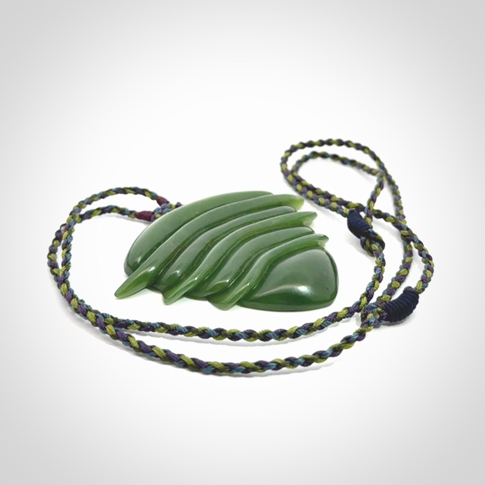Hand carved New Zealand Jade drop pendant with adjustable cord. Free shipping worldwide.
