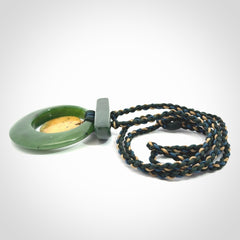 Hand carved New Zealand Jade peace bell pendant with adjustable cord. Free shipping worldwide.