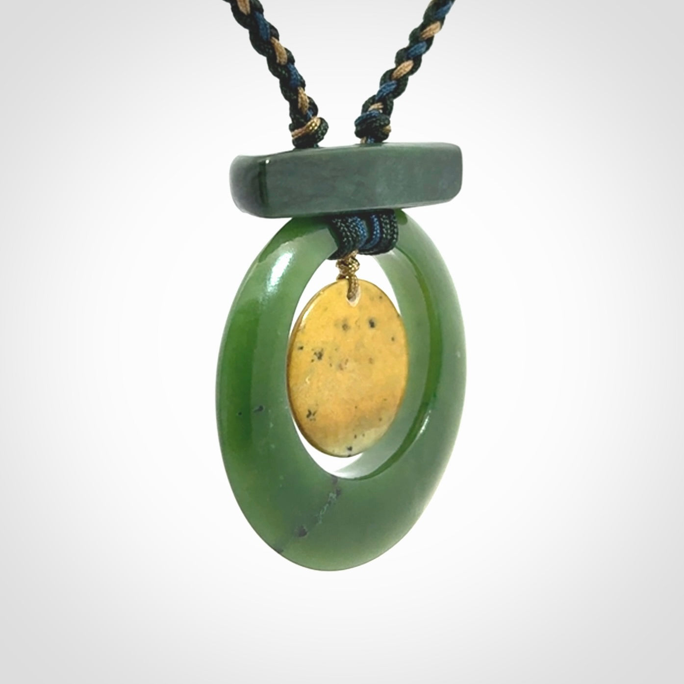 Hand carved New Zealand Jade peace bell pendant with adjustable cord. Free shipping worldwide.