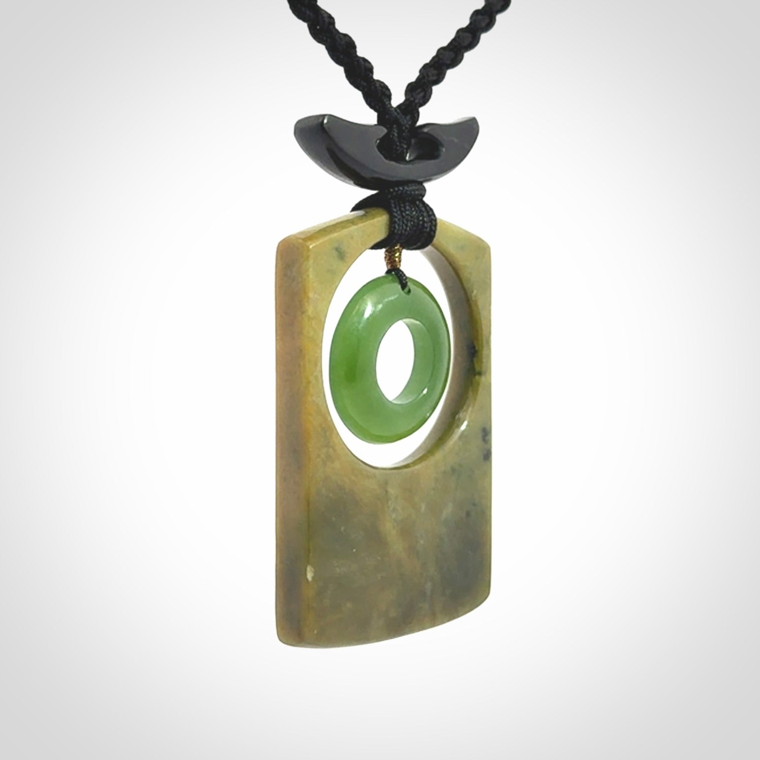 Hand carved New Zealand Jade pendant with adjustable cord. Free shipping worldwide.