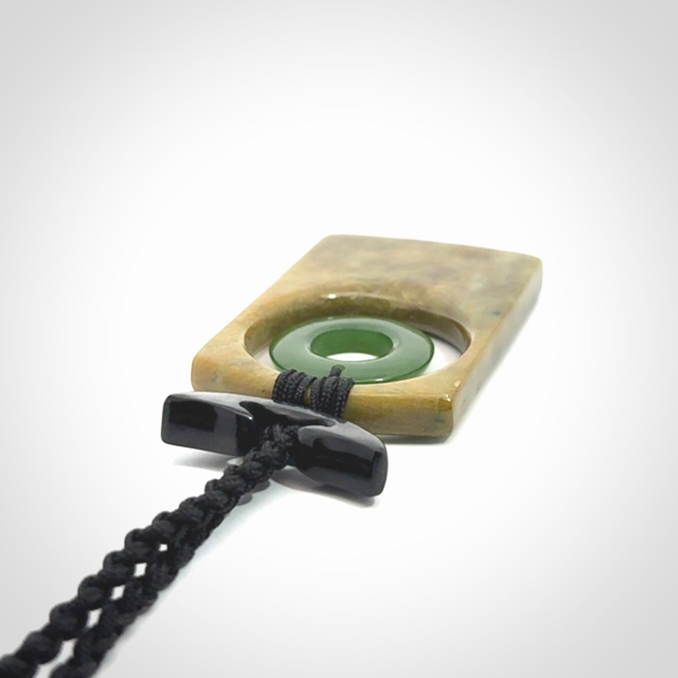 Hand carved New Zealand Jade pendant with adjustable cord. Free shipping worldwide.