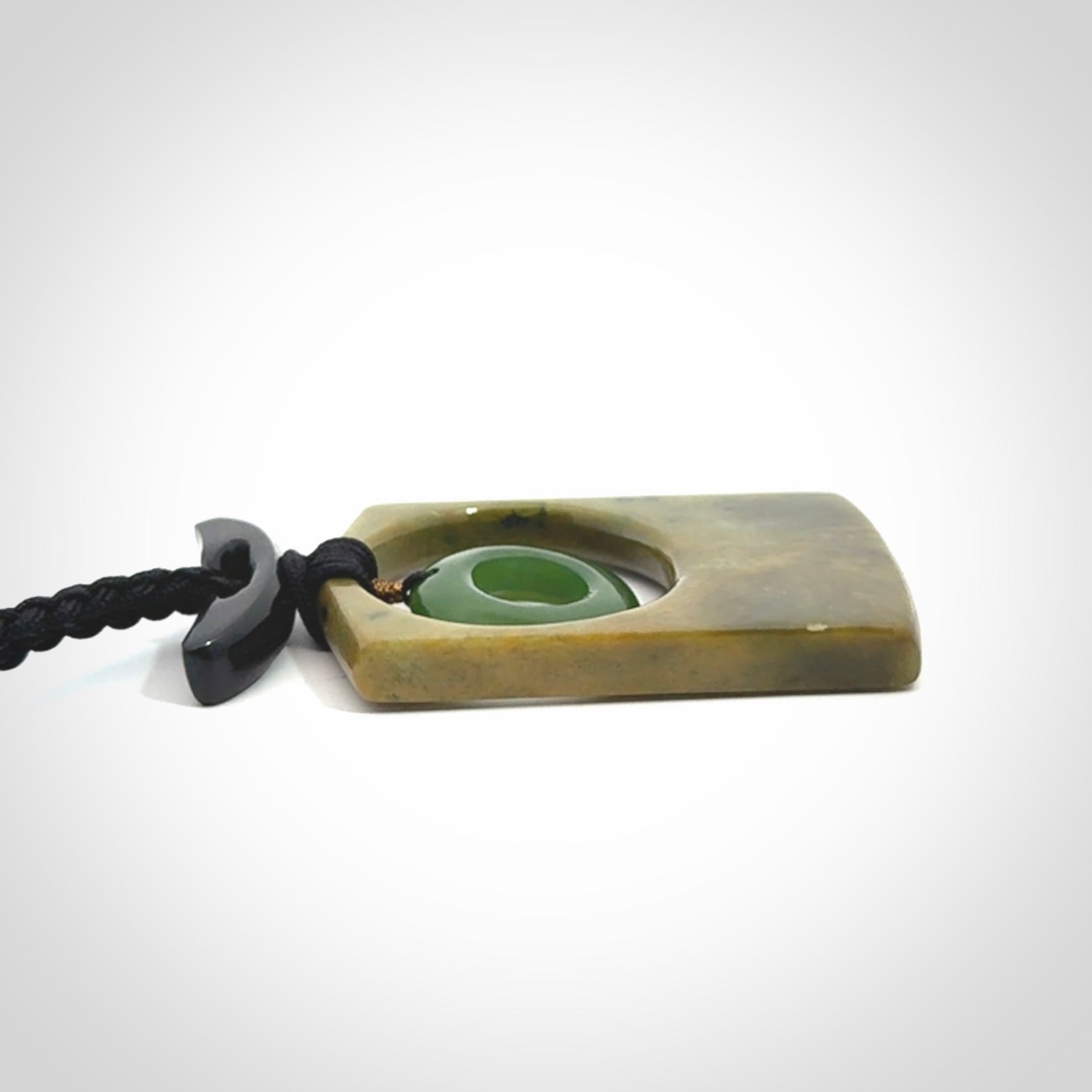 Hand carved New Zealand Jade pendant with adjustable cord. Free shipping worldwide.