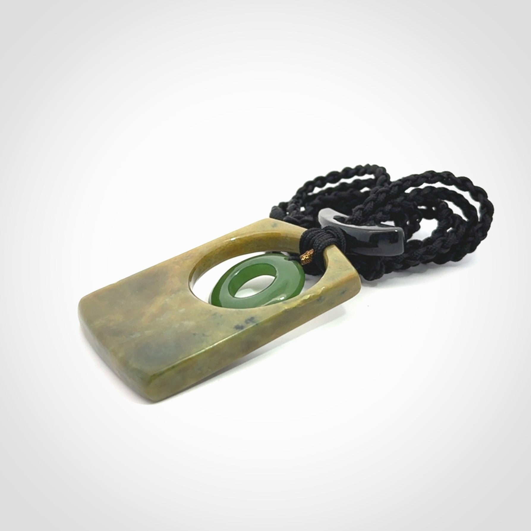 Hand carved New Zealand Jade pendant with adjustable cord. Free shipping worldwide.