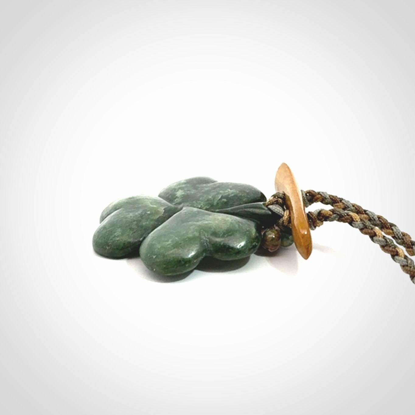 Hand carved New Zealand Jade flower pendant with adjustable cord. Free shipping worldwide.