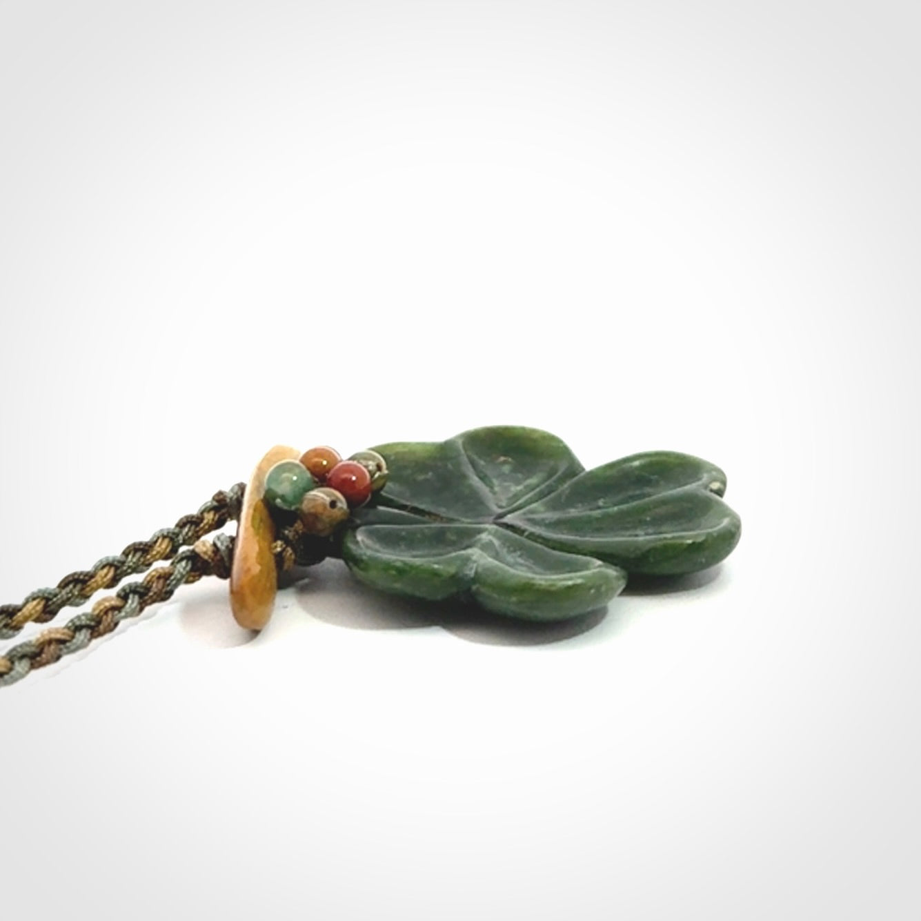 Hand carved New Zealand Jade flower pendant with adjustable cord. Free shipping worldwide.