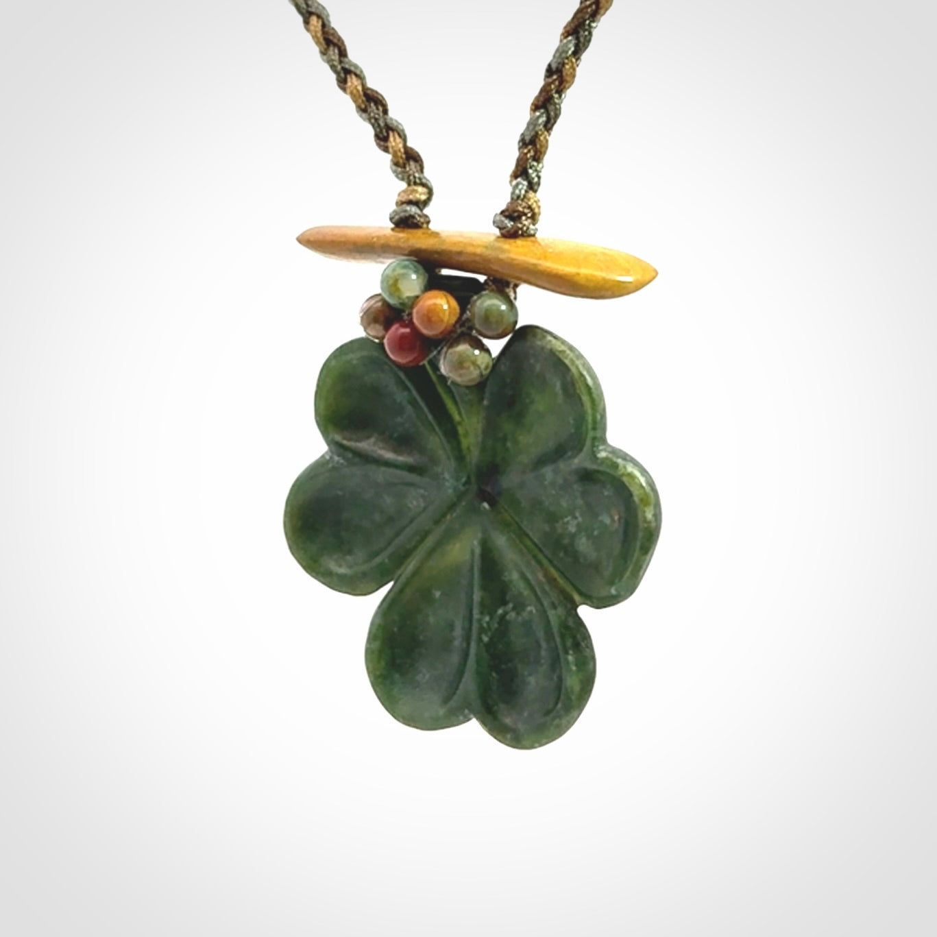 Hand carved New Zealand Jade flower pendant with adjustable cord. Free shipping worldwide.