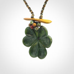 Hand carved New Zealand Jade flower pendant with adjustable cord. Free shipping worldwide.
