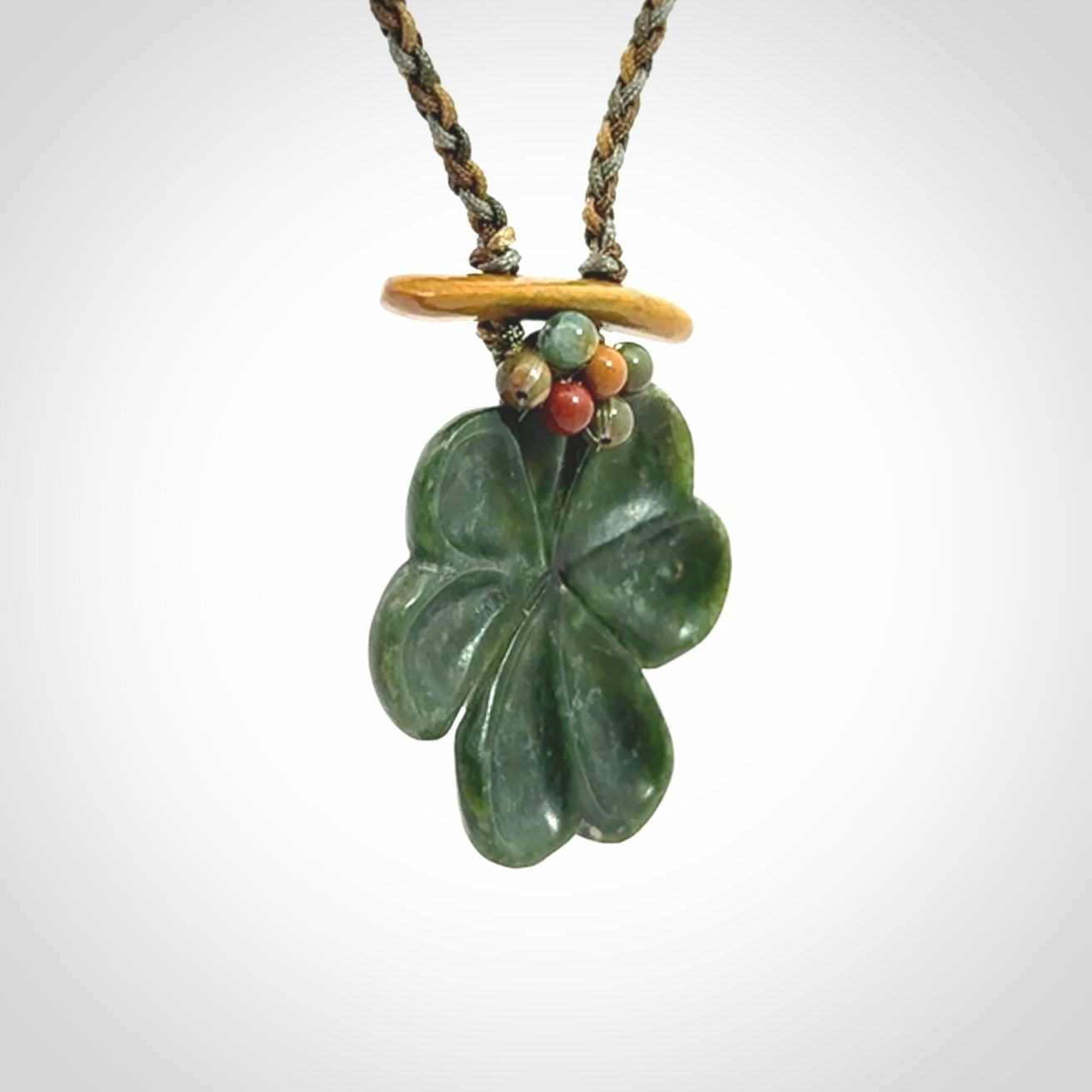 Hand carved New Zealand Jade flower pendant with adjustable cord. Free shipping worldwide.