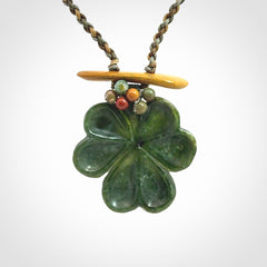 Hand carved New Zealand Jade flower pendant with adjustable cord. Free shipping worldwide.