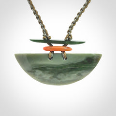 Hand carved New Zealand Jade half shield pendant with adjustable cord. Free shipping worldwide.