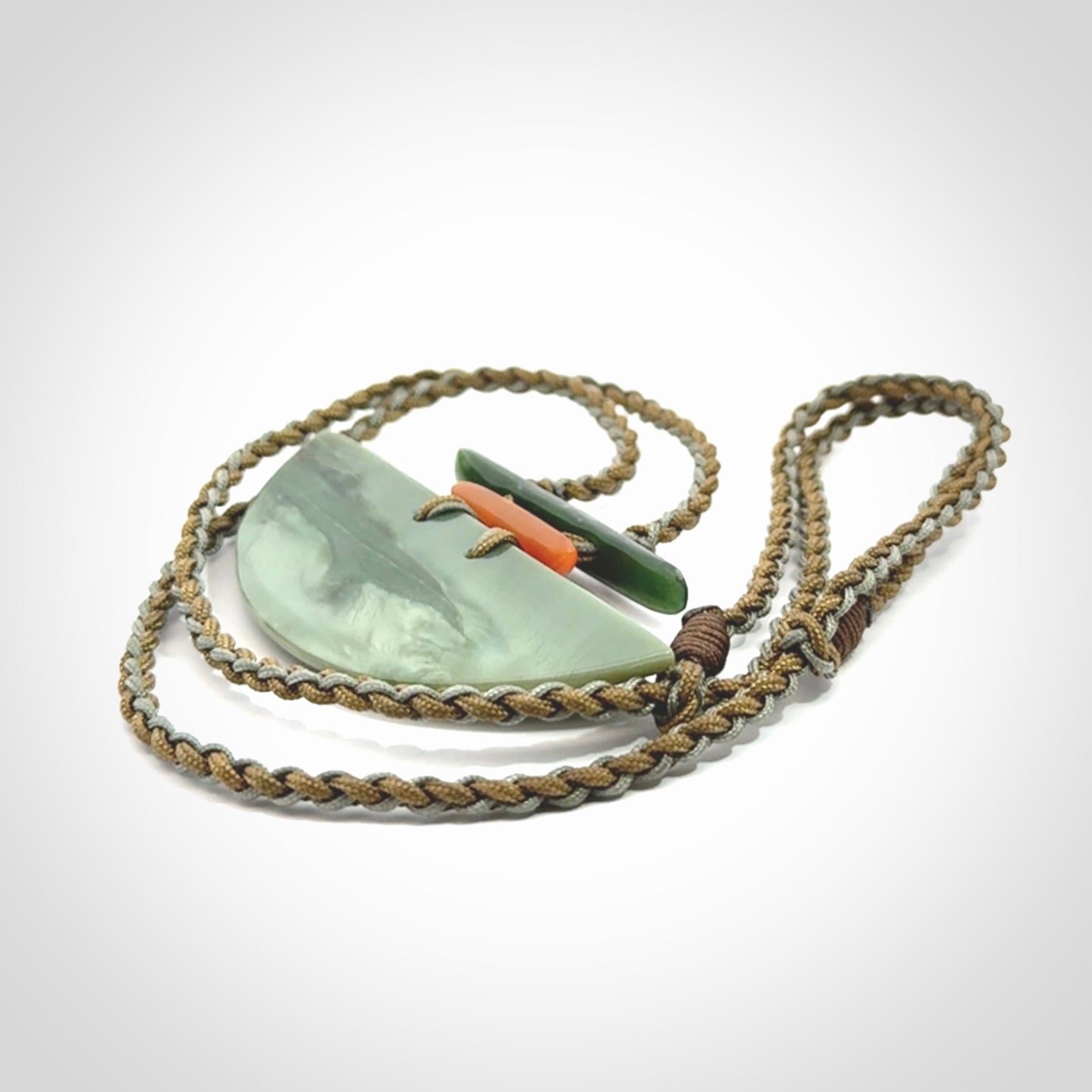 Hand carved New Zealand Jade half shield pendant with adjustable cord. Free shipping worldwide.
