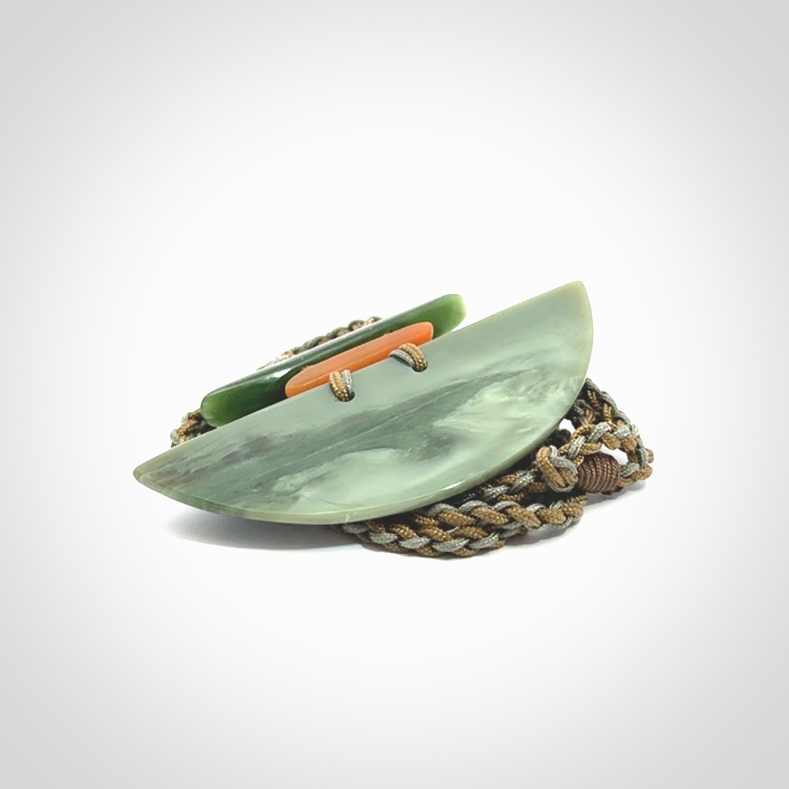 Hand carved New Zealand Jade half shield pendant with adjustable cord. Free shipping worldwide.