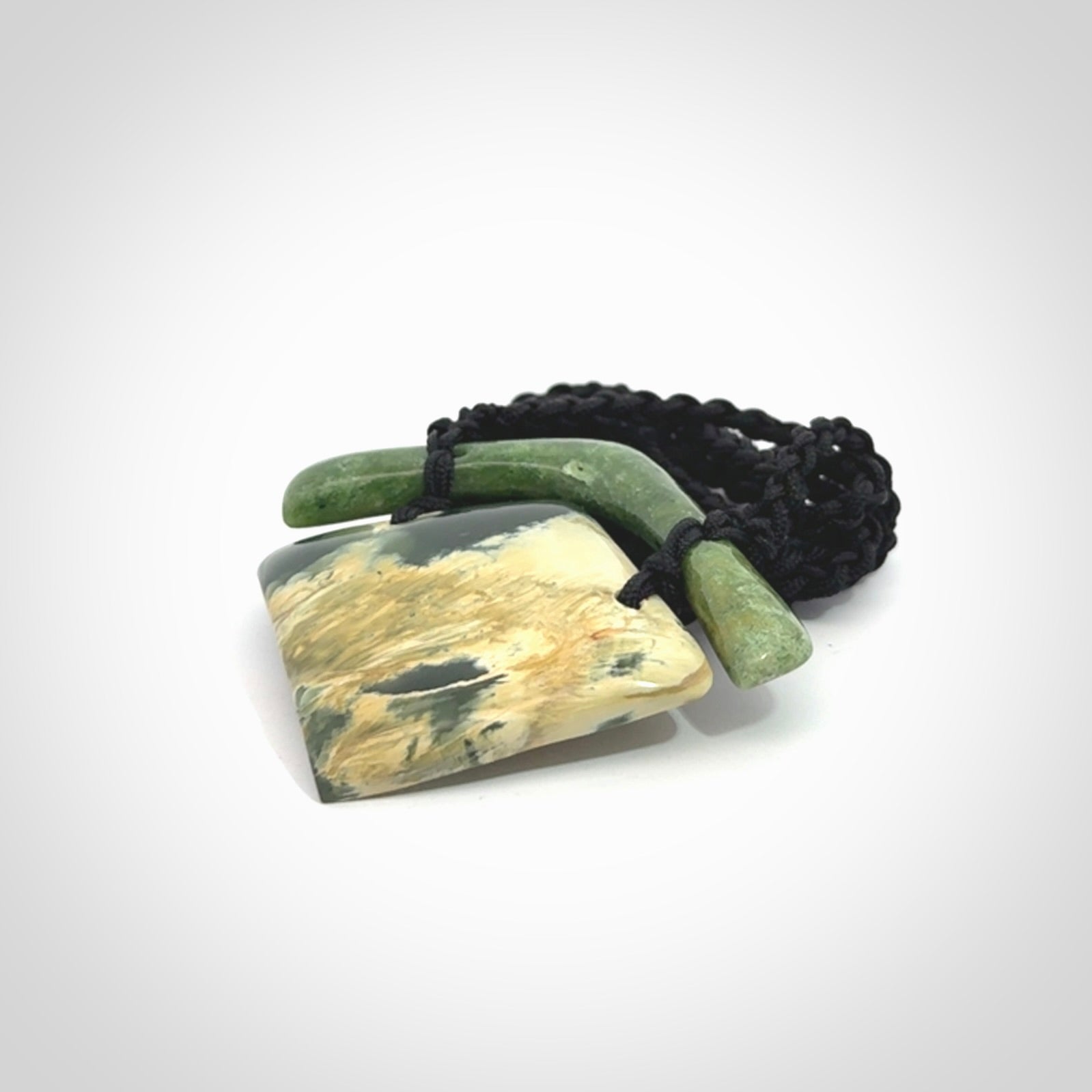 Hand carved New Zealand Jade drop pendant with adjustable cord. Free shipping worldwide.