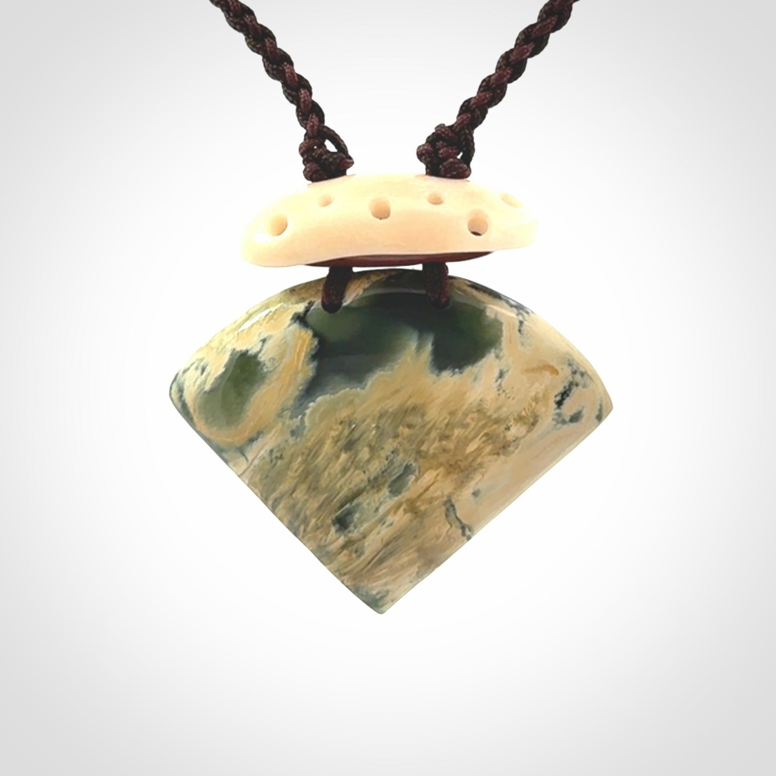 Hand carved New Zealand Jade drop pendant with adjustable cord. Free shipping worldwide.