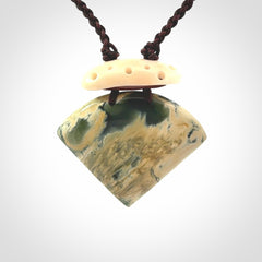 Hand carved New Zealand Jade drop pendant with adjustable cord. Free shipping worldwide.