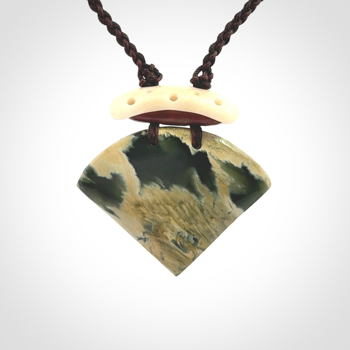 Hand carved New Zealand Jade drop pendant with adjustable cord. Free shipping worldwide.