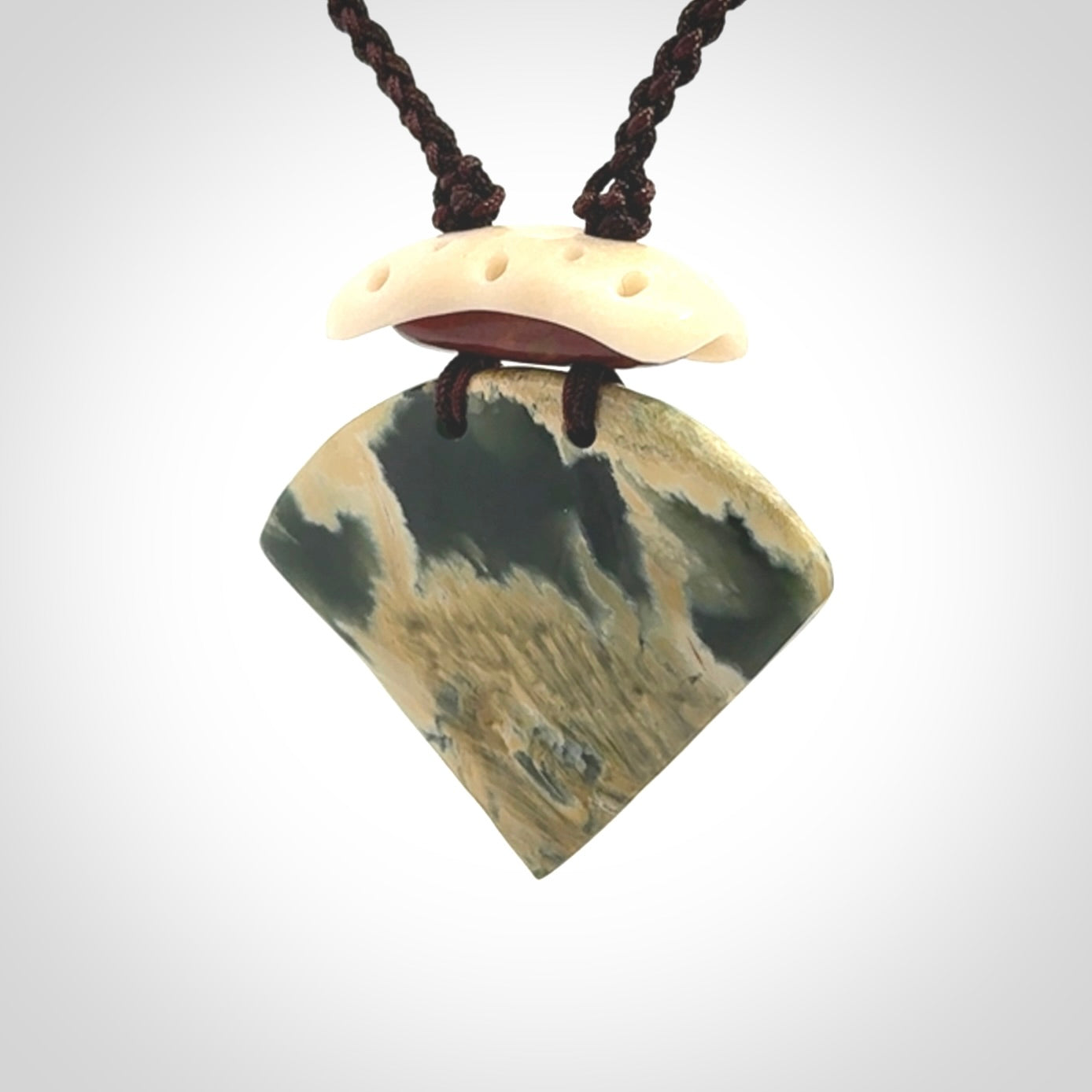 Hand carved New Zealand Jade drop pendant with adjustable cord. Free shipping worldwide.