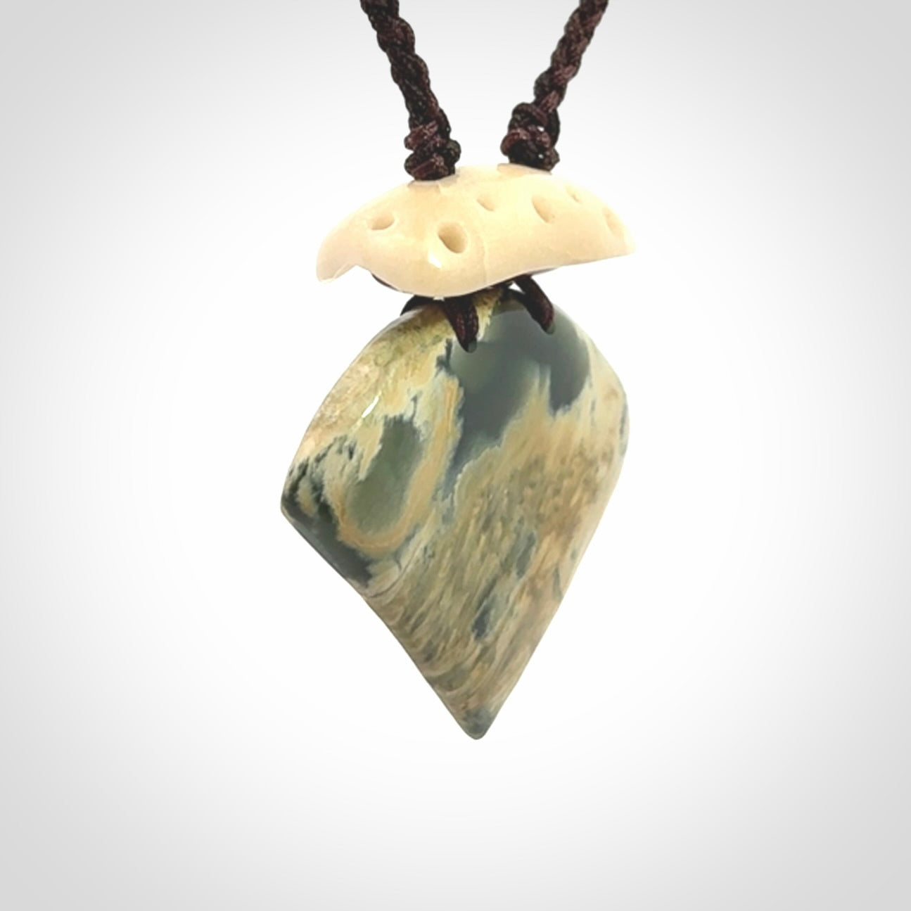 Hand carved New Zealand Jade drop pendant with adjustable cord. Free shipping worldwide.