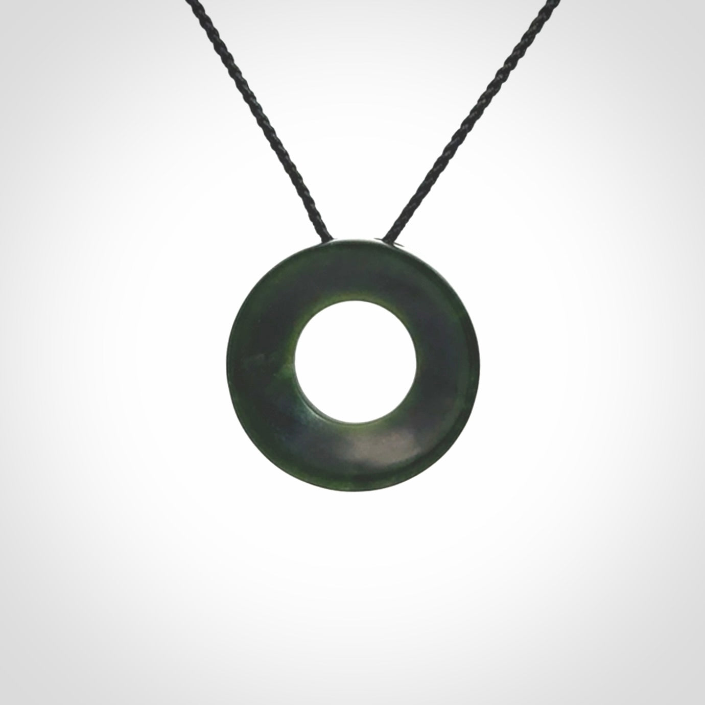 Hand carved contemporary pendant from a lovely dark piece of New Zealand Jade.