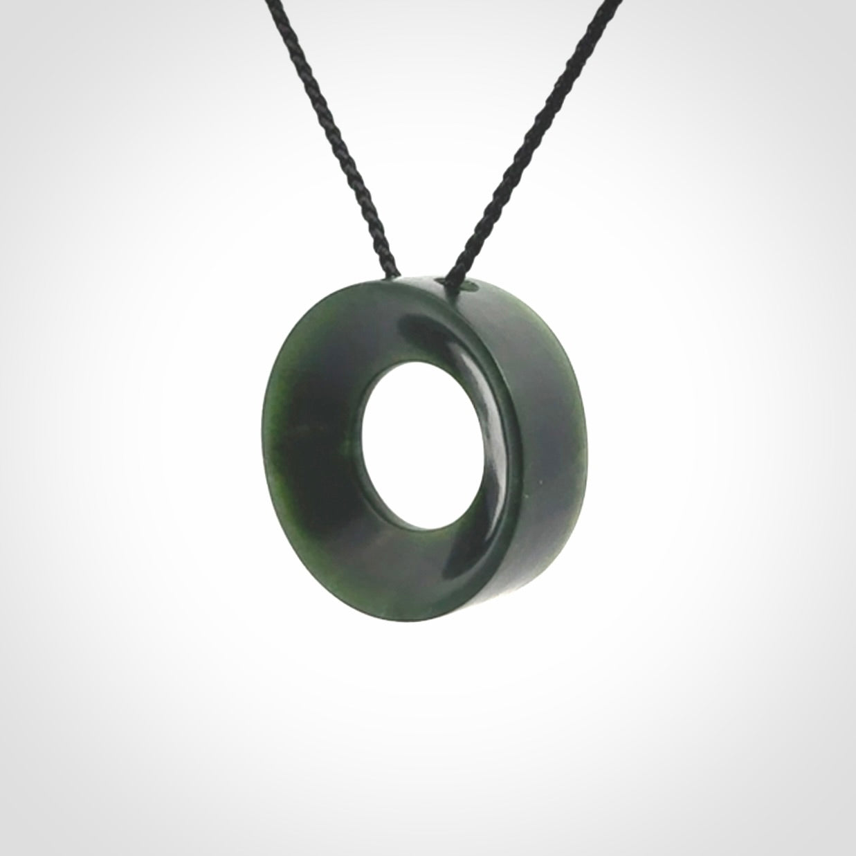 Hand carved contemporary pendant from a lovely dark piece of New Zealand Jade.