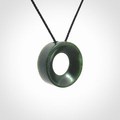 Hand carved contemporary pendant from a lovely dark piece of New Zealand Jade.