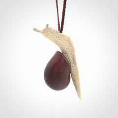 Snail design pendant carved in red jasper with deer antler. Real jasper and bone jewellery for sale online with NZ Pacific.