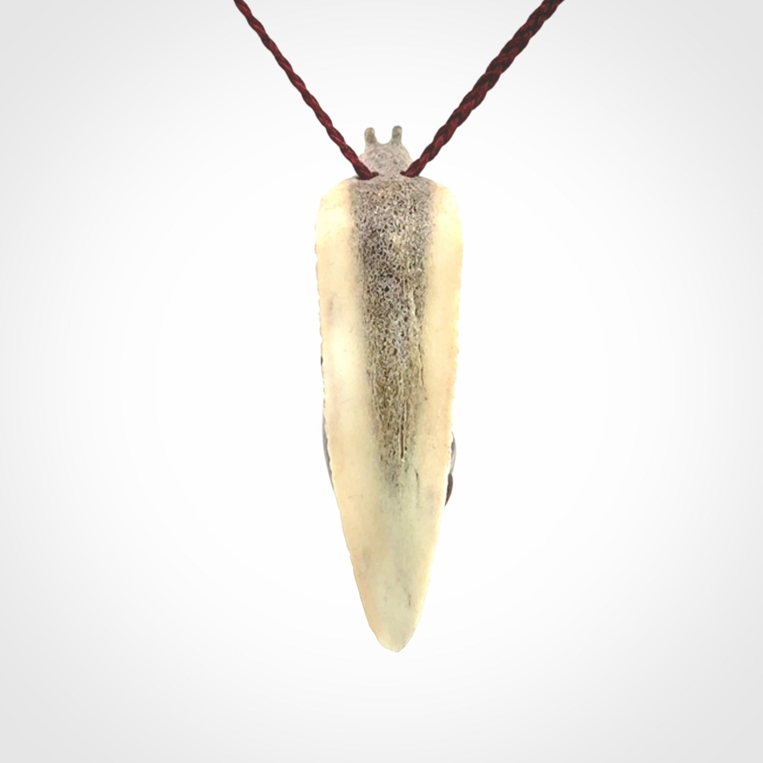 Snail design pendant carved in red jasper with deer antler. Real jasper and bone jewellery for sale online with NZ Pacific.