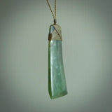 Hand carved from a lovely piece of local New Zealand Jade. The quality of the workmanship and design is outstanding - this is a piece you will want to wear all the time. We have suspended this from a 4-plait olive cord which can be adjusted with a couple of slip knots and olive binding.