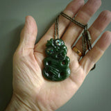 This is a medium sized tiki - carved from gorgeous Marsden jade. The craftsmanship is superb, this piece is as well carved as any we have seen. The cord is an adjustable plaited cord in black.