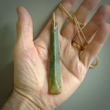 This is a lovely, large, New Zealand Flower Jade, pounamu drop pendant. Hand carved for us by Ric Moor. It is bound with an adjustable beige coloured cord which is length adjustable. Free worldwide shipping. The light reveals the internal structure and colour of the stone beautifully.