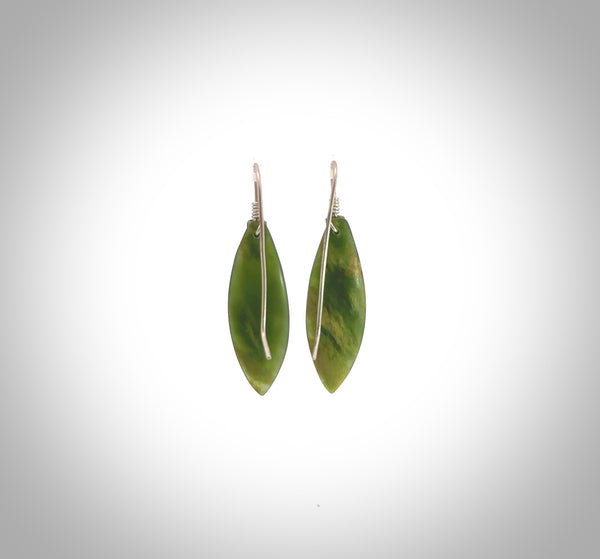 These are stunning medium sized drop flower jade earrings carved in New Zealand by Josey Coyle. It is carved from a beautiful green piece of New Zealand Flower Jade and with Sterling Silver hooks and findings.