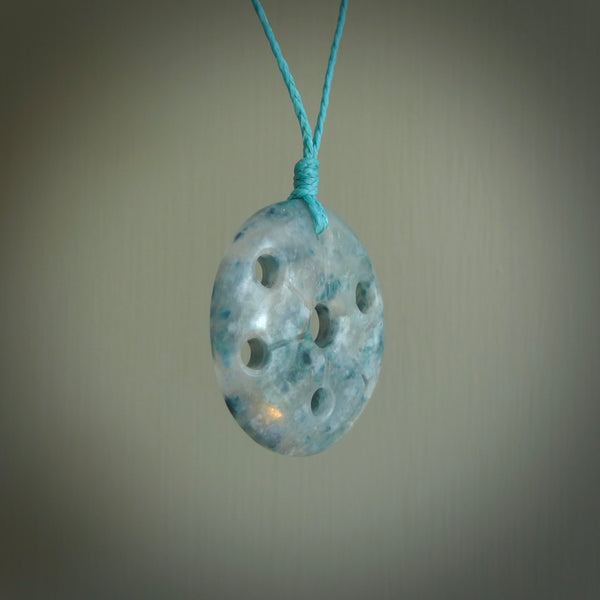 This is a handcrafted aotea stone contemporary disc pendant. This is a wonderful work of art hand made by Ana Krakosky. We ship this worldwide for free and are happy to answer any questions that you may have about these or other products on our website.