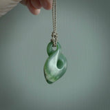 Hand carved medium sized, New Zealand jade twist pendant. Carved in New Zealand by NZ Pacific. Māori themed jewellery for sale online.