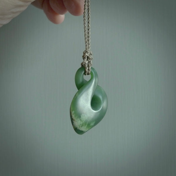 Hand carved medium sized, New Zealand jade twist pendant. Carved in New Zealand by NZ Pacific. Māori themed jewellery for sale online.