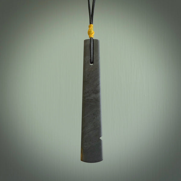 Hand made large New Zealand argillite toki pendant. Hand carved in New Zealand by Rueben Tipene. Hand made jewellery. Unique large argillite Toki with adjustable cord. Free shipping worldwide.