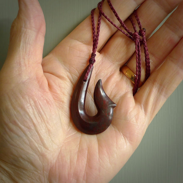 Hand carved Red Jasper Stone pendant. Hook, matau pendant hand made in New Zealand. NZ Pacific jewellery for sale online.