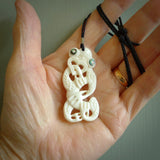 Hand carved bone Tiki pendant. Traditional art hand carved for NZ Pacific. Bone Tiki necklace with Paua Shell eyes.