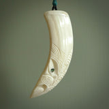 Hand carved engraved boars tusk pendant, carved by us. This particular piece is a contemporary design and is lovingly carved.