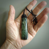 Hand made large New Zealand jade toki pendant. Hand carved in New Zealand by Raegan Bregmen . Hand made jewellery. Unique large Jade Toki with adjustable length black coloured cord. Free shipping worldwide.